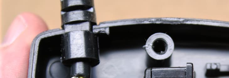 Reseat the strain relief bushing into the notch in the controller housing