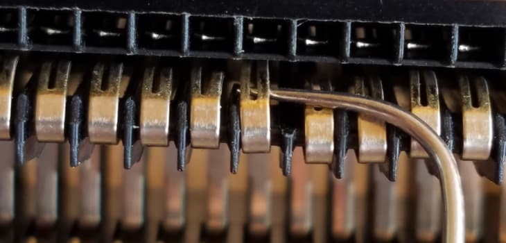 Close up of bending pins to rehab an NES 72-pin connector