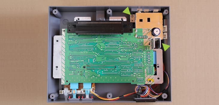 Remove the two screws to free the motherboard