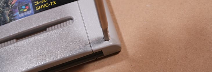 Unscrew the screws with the game bit screwdriver to open the case