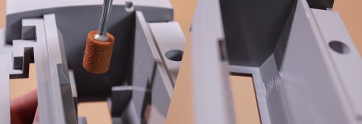 Using a dremel tool to remove the tabs inside the Super NES cartridge slot assembly, or to finish it after being otherwise removed